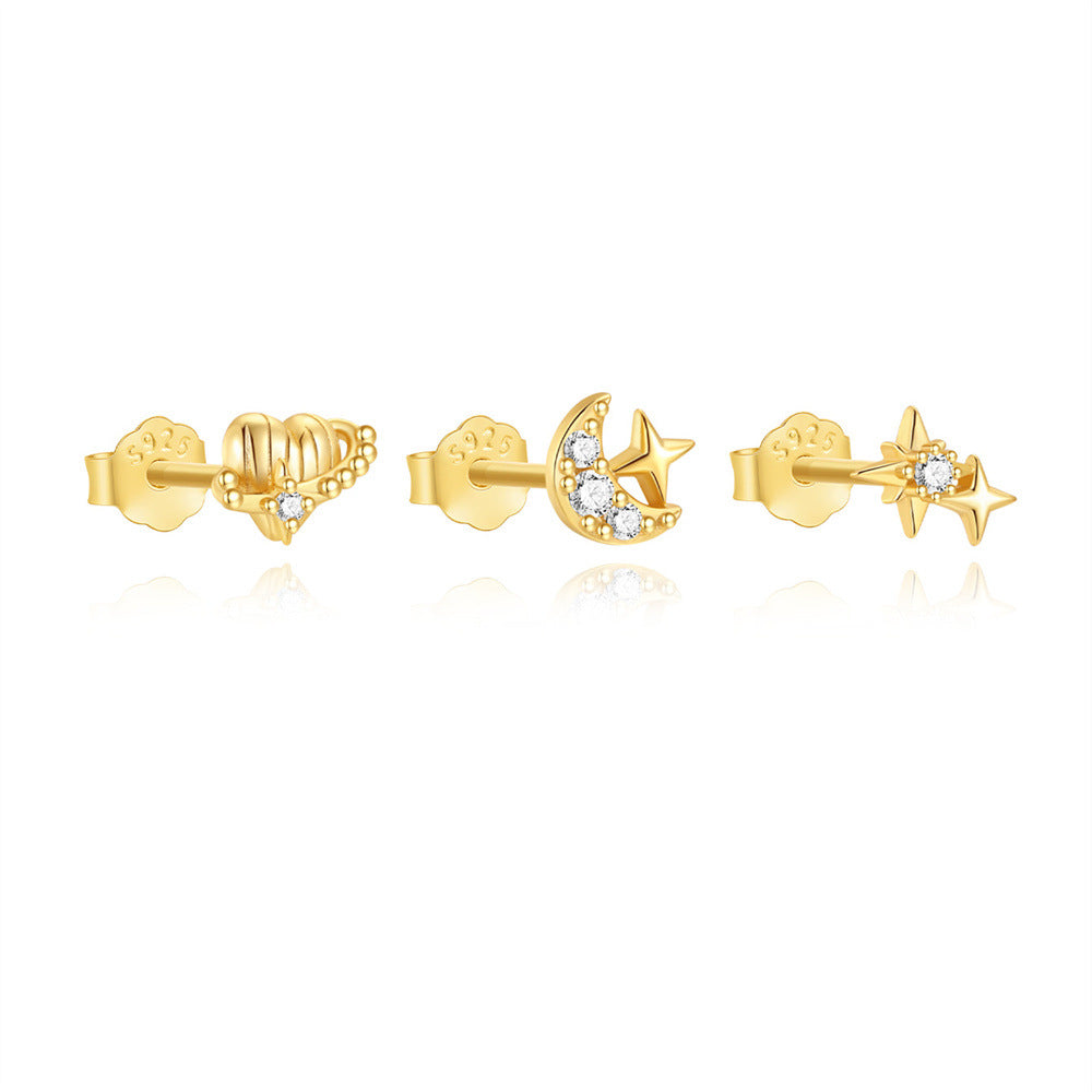 front view of gold plated moon star and planet stud set