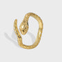 isolated gold plated brass open ring shaped as a coiled snake