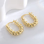 gold plated twisted rope hoop earrings in an angled studio view