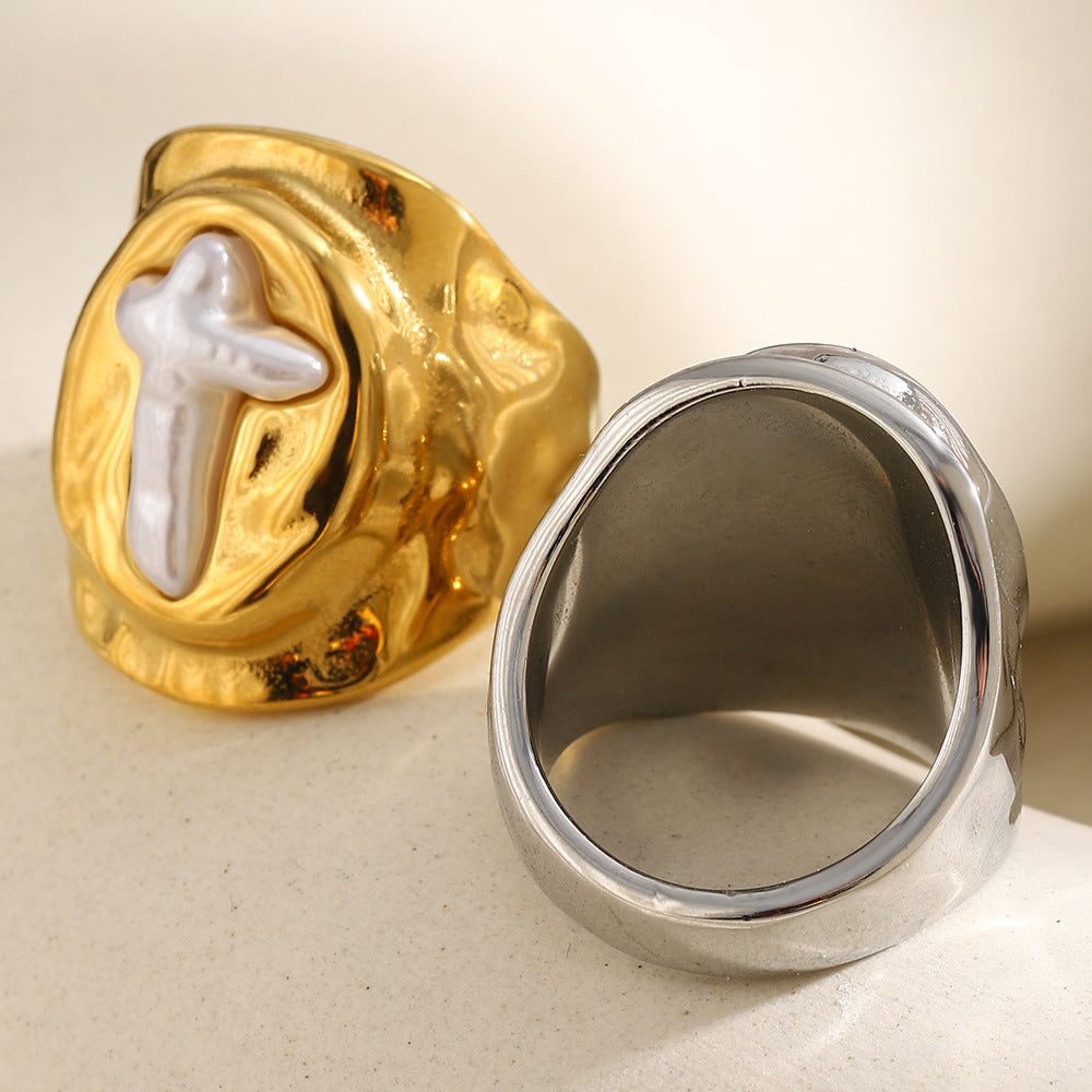 front and back views of sculpted cross signet rings