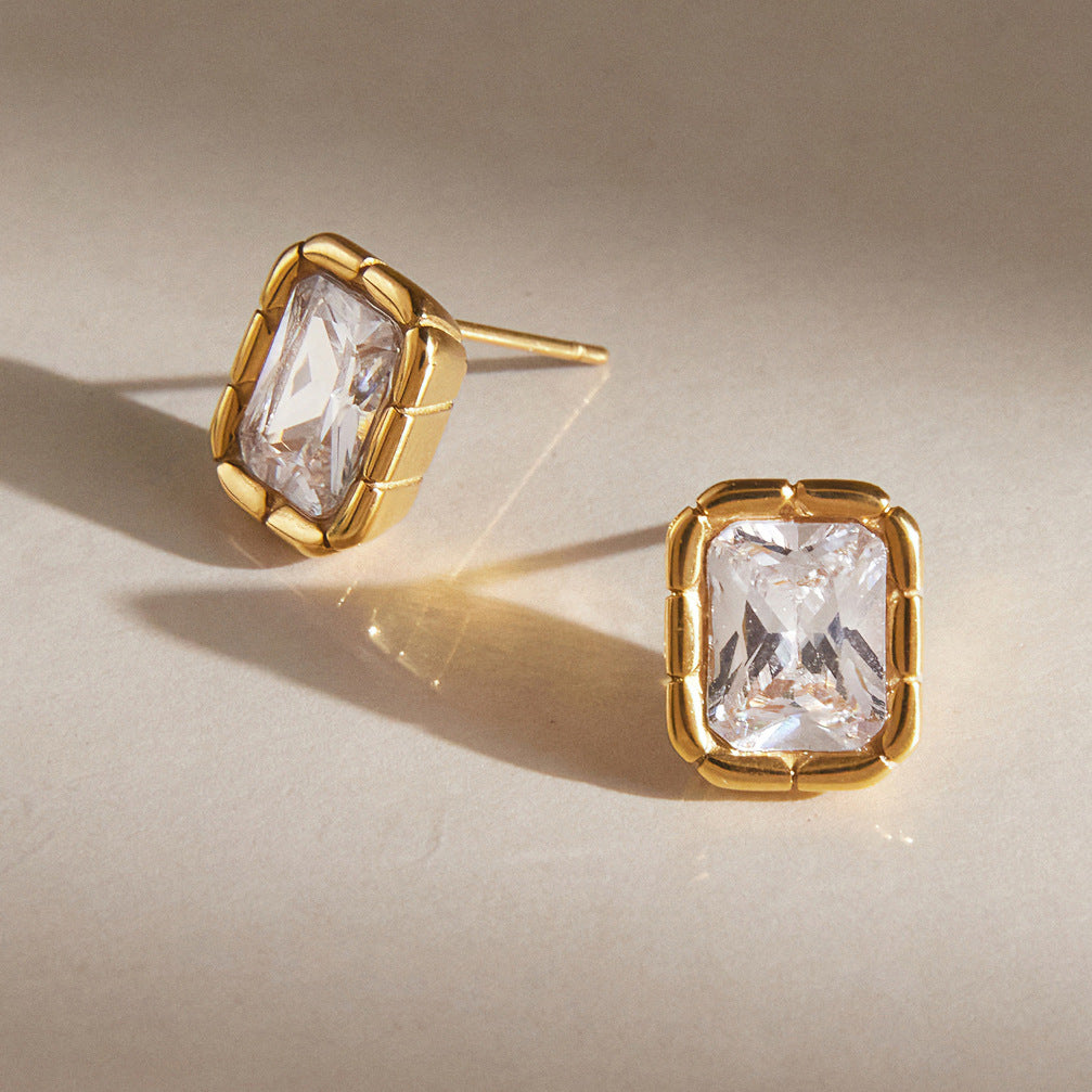 Pair of framed zirconia studs with posts visible
