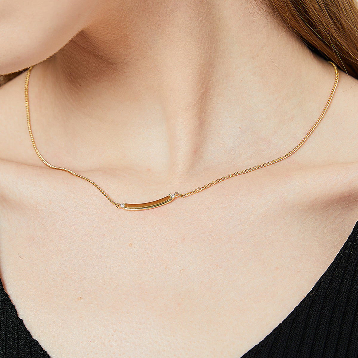 minimalist polished bar necklace worn at the collarbone