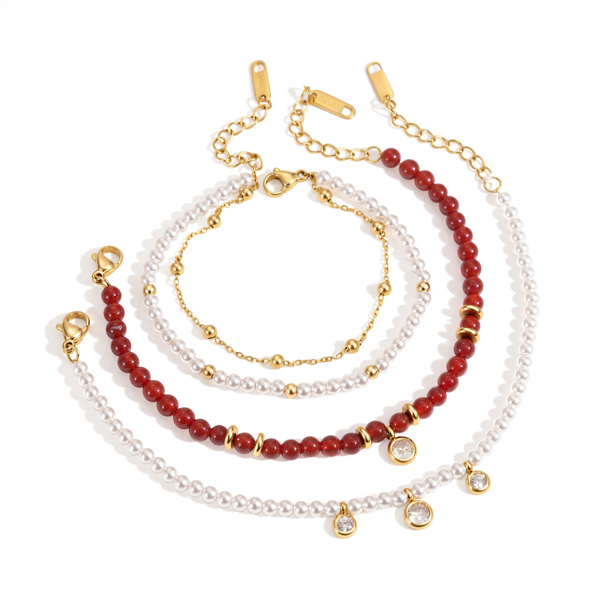 Red and white beaded stainless steel bracelets on white
