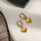 Gold-Tone Heart Charm Stainless Steel Hoop Earrings close-up view