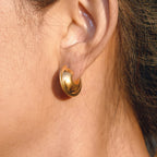 gold plated chunky C-hoop earring worn on ear