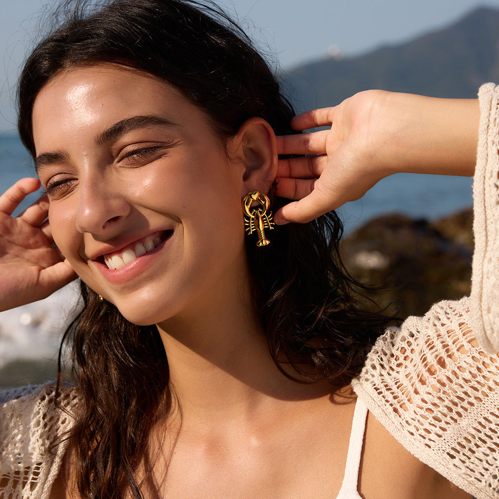 Lobster stud earring shown on a model