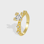 isolated gold plated geometric ring with clear zirconia center