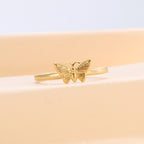 front view of open butterfly wings and slim polished band