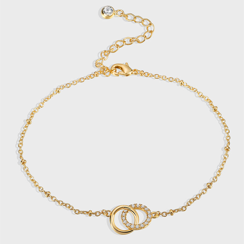 gold plated brass anklet with interlocking rings and cubic zirconia