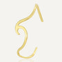 isolated gold plated brass open cuff shaped like a curling wave