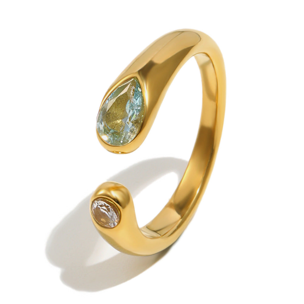 gold plated snake open ring with light blue and clear stones