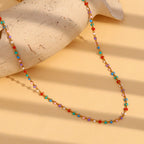 Multicolor bead necklace arranged on a textured display
