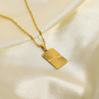 gold plated 316L stainless steel necklace with rectangular sunburst tag pendant