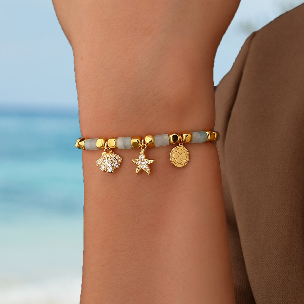 model wearing the coastal shell and starfish bracelet