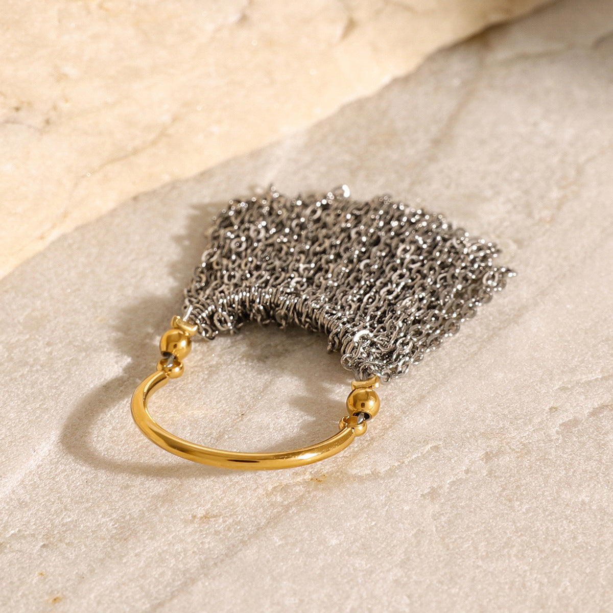 Silver-tone chain curtain with gold-tone attachment details