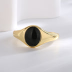 front view of the smooth black cabochon and flared shoulders