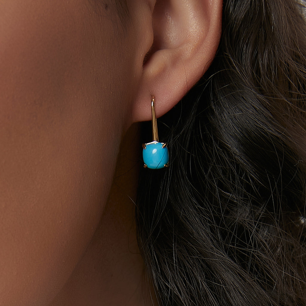 blue cushion cabochon hook earring worn on the ear