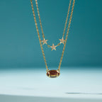 double-chain necklace with brown football and three clear-stone stars