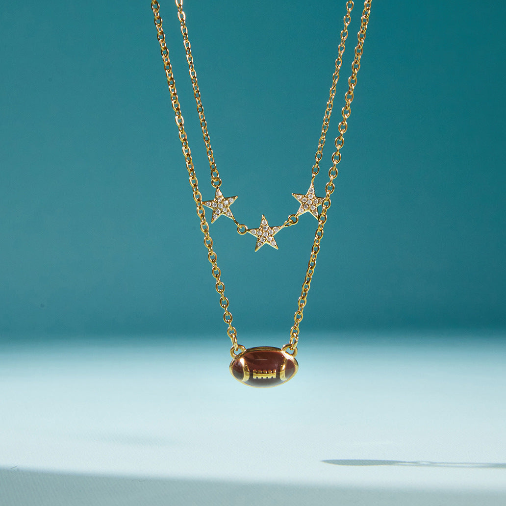double-chain necklace with brown football and three clear-stone stars