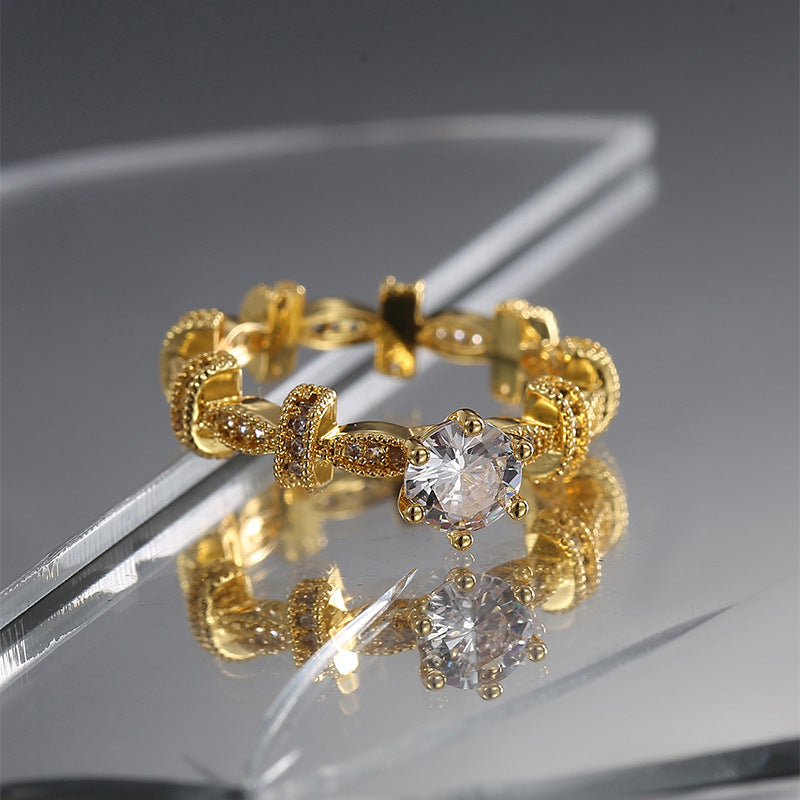 gold plated brass linked ring on reflective display