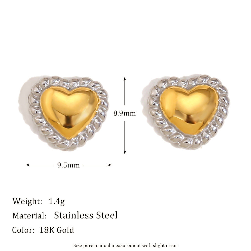 Small gold tone heart studs with textured silver tone border