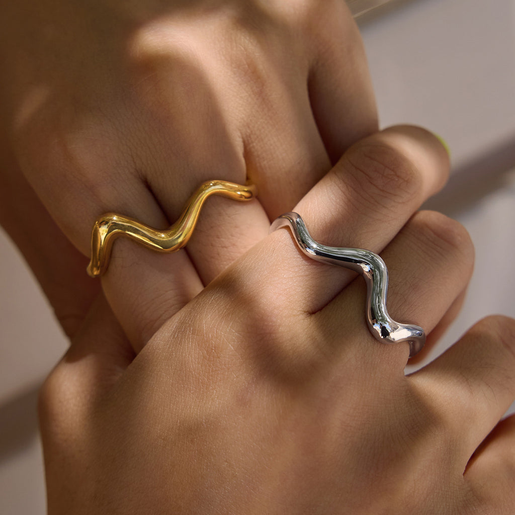 Wave rings worn across adjacent fingers