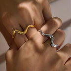Wave rings worn across adjacent fingers