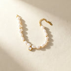 Irregular white bead bracelet with a round clear center accent