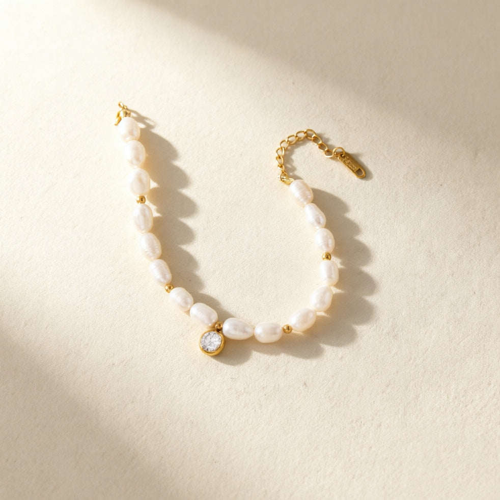 Irregular white bead bracelet with a round clear center accent