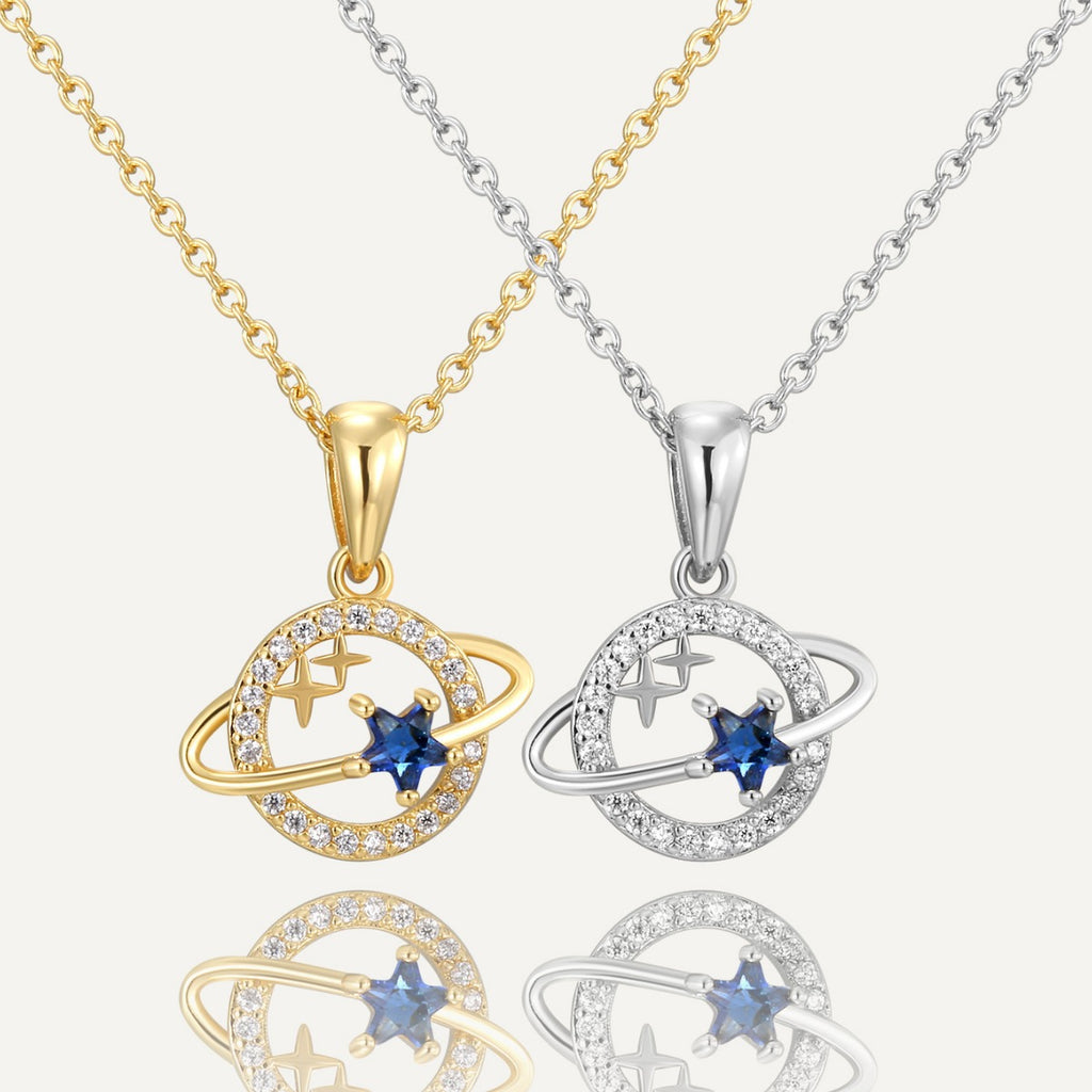 gold plated and silver-finish orbit planet necklaces with blue star stones