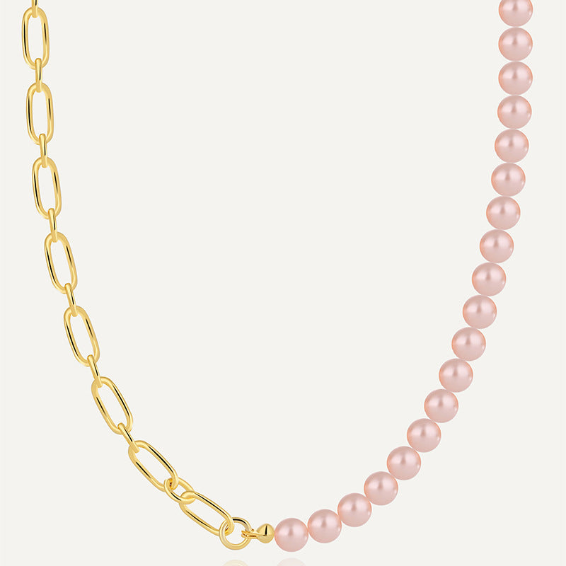 gold plated asymmetrical necklace with oval links and pink shell beads