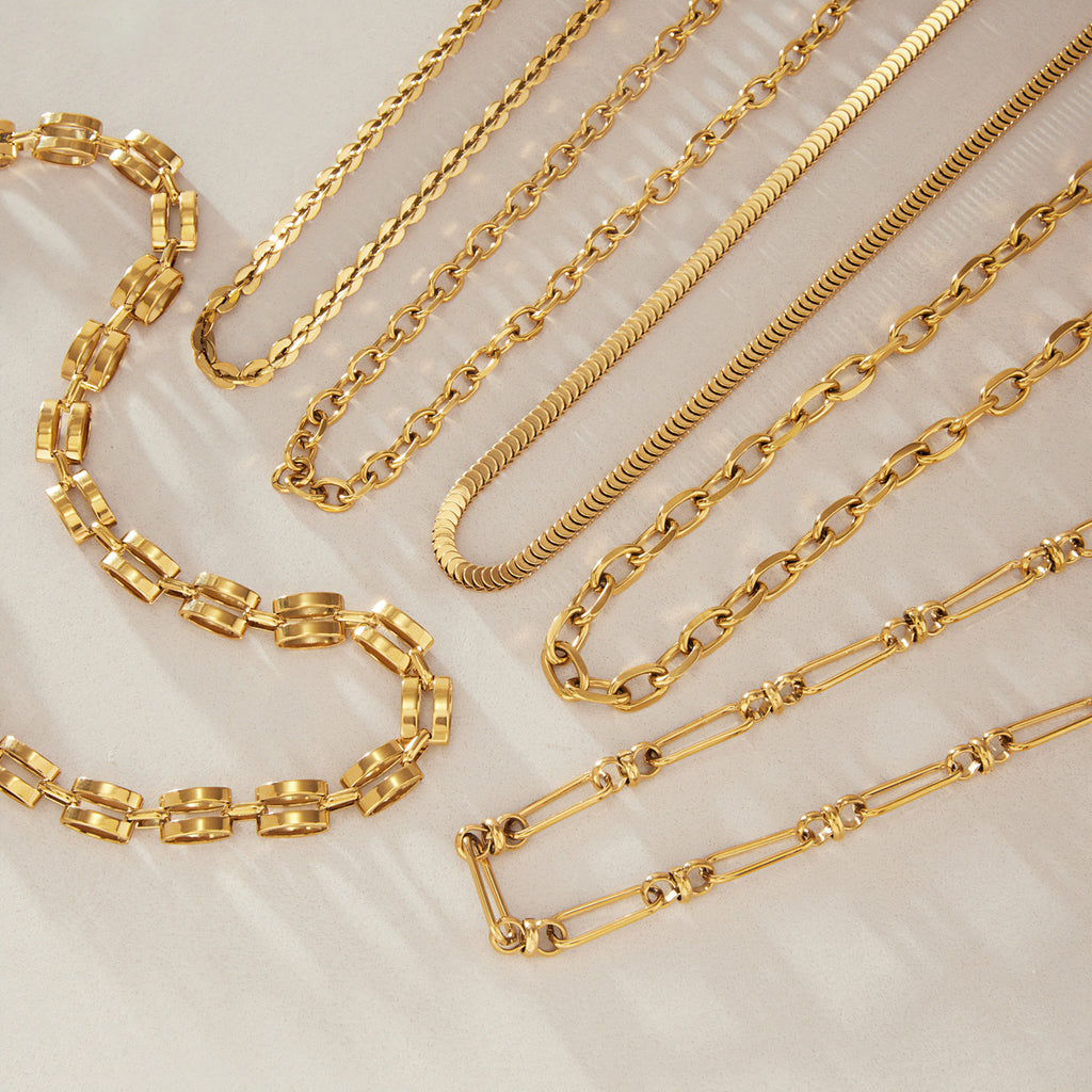 Mixed stainless steel chains arranged in loose curves