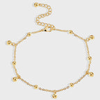 gold plated anklet with spaced polished bead drops
