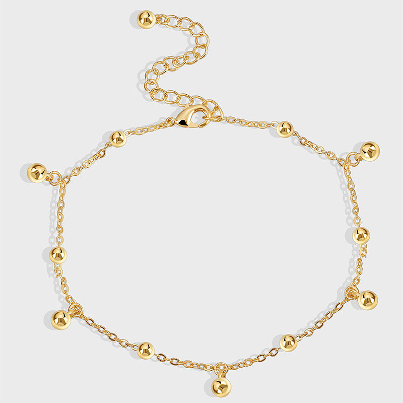 gold plated anklet with spaced polished bead drops