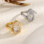 oval clear-stone cocktail rings in gold plated and silver finishes