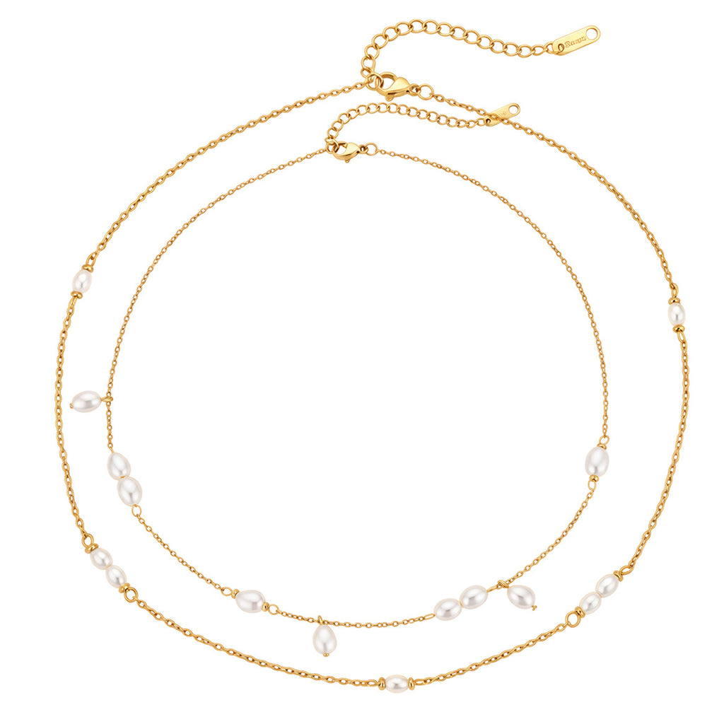 Station and cluster necklaces on white
