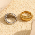 rear view of gold plated and silver-finish ribbed dome rings