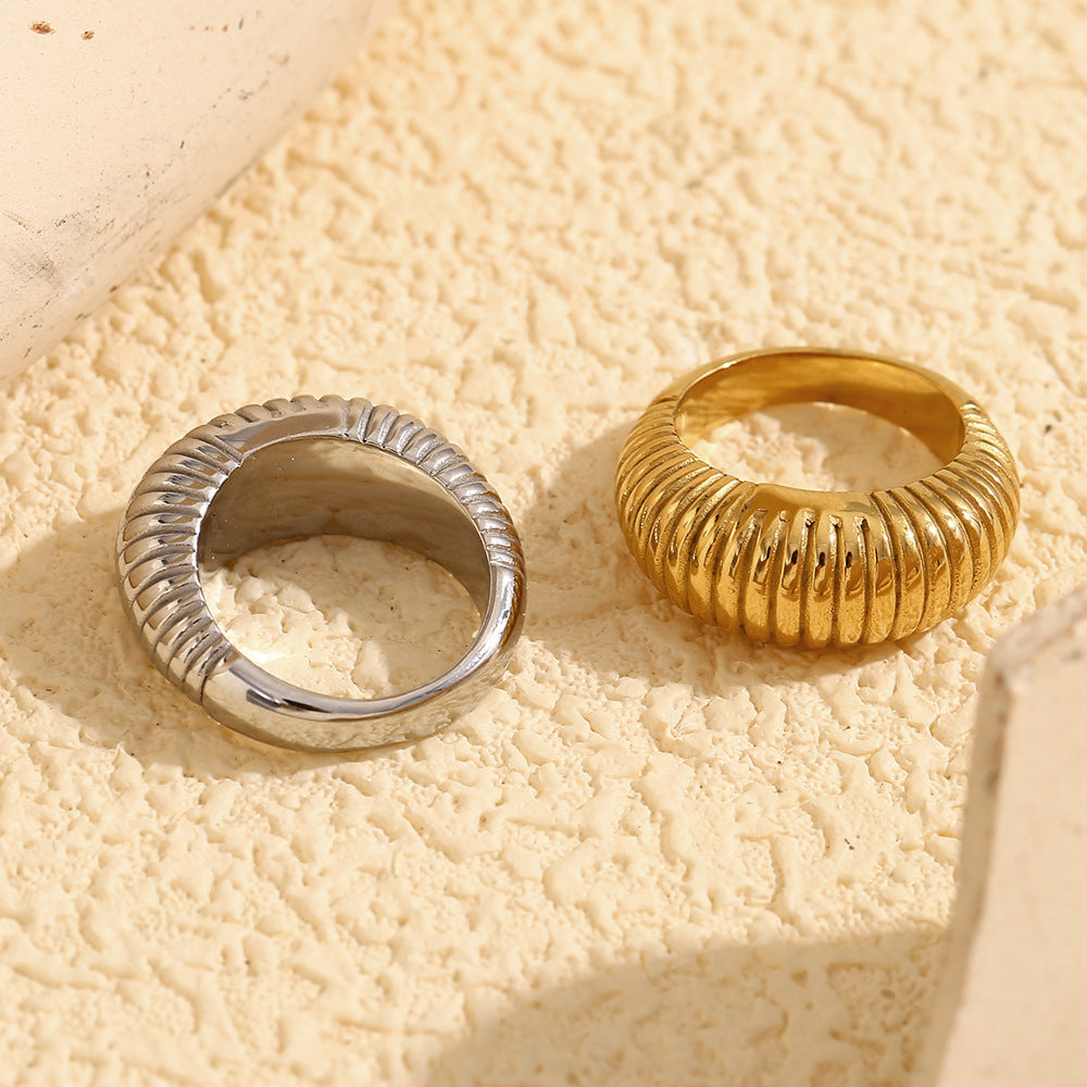 rear view of gold plated and silver-finish ribbed dome rings