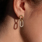 Gold tone linked teardrop earring with clear stone lower loop when worn