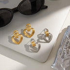 Two-Tone Open Heart Stainless Steel Drop Earrings — front view of the gold outer-heart option