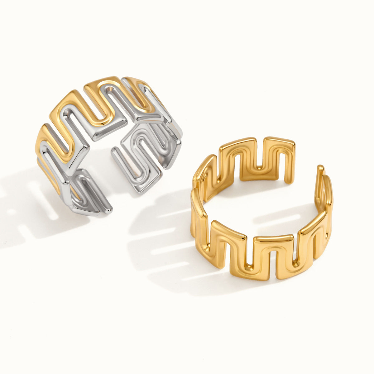 Gold tone and two-tone meander rings front view
