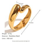 twin snake-head bangle with 72 mm profile and 65.9 g listed weight