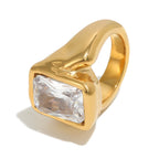 isolated gold plated rectangular clear-stone signet ring