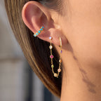 gold plated multicolor rhinestone chain tassel earrings worn on ear