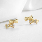 pair of gold plated 925 silver asymmetric bow stud earrings