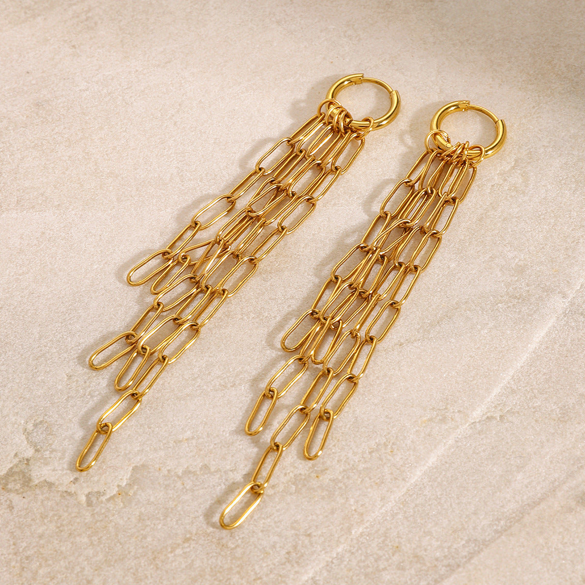 Gold-tone chain tassel earrings styled pair