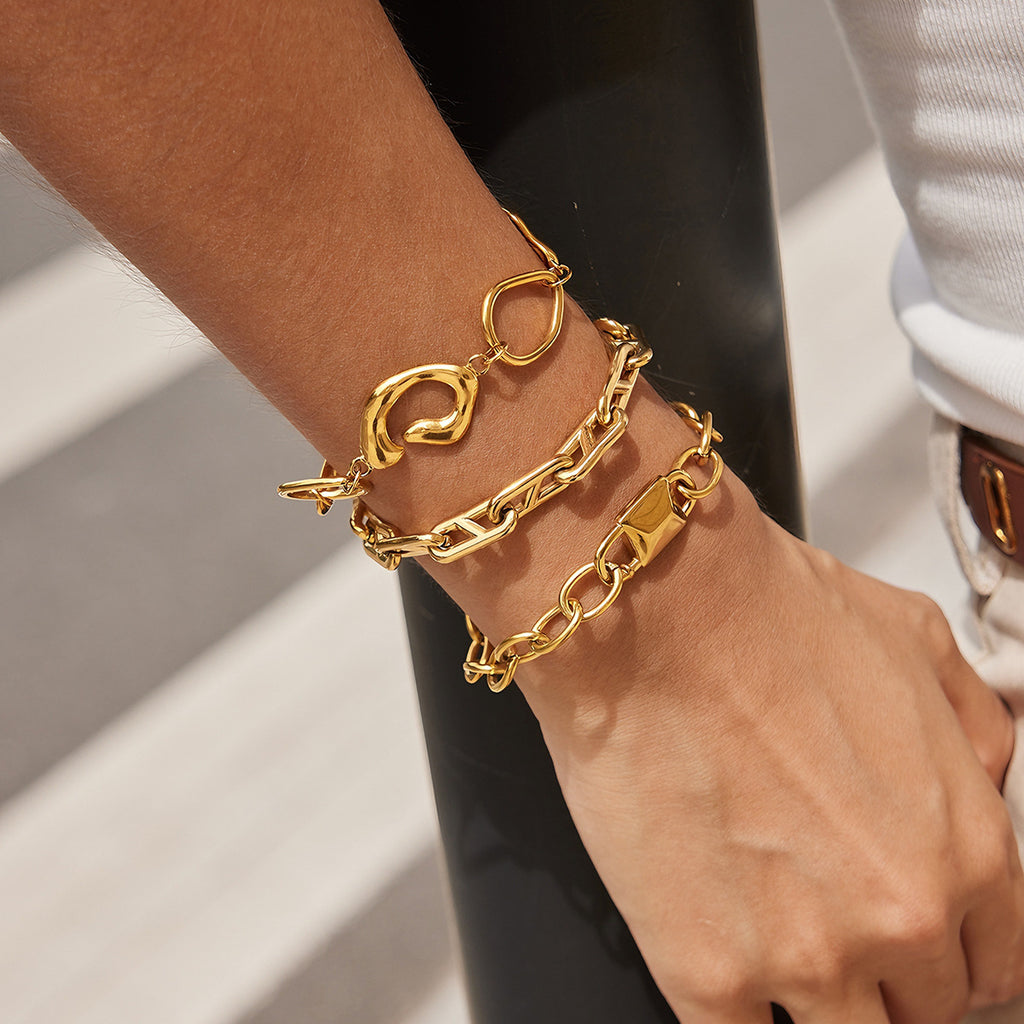 Sculpted and angular link bracelets on the wrist
