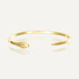 gold plated tapered open cuff with a single clear zirconia terminal