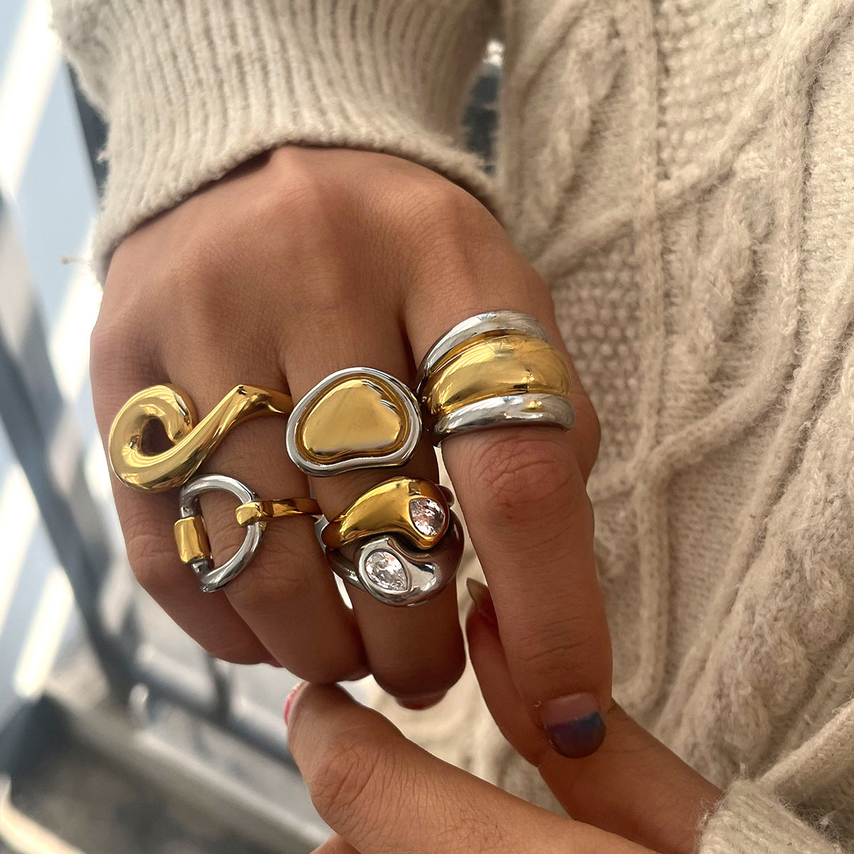 Two-Tone Sculptural Stainless Steel Ring Collection styled product view