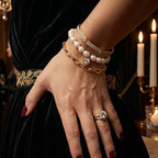 White bead bracelet layered on the wrist